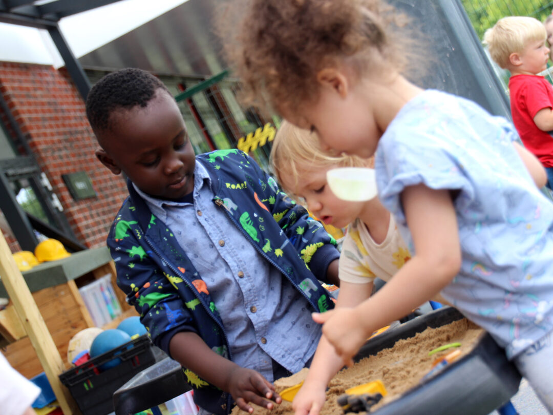 Children play with sandbox